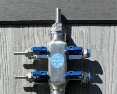 Custom four-way stainless manifold with mixed outlets